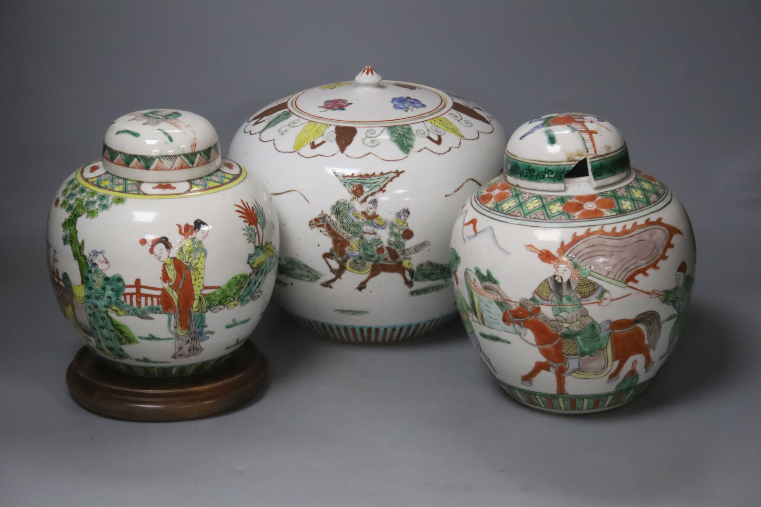 Three large 20th century Chinese porcelain famille verte jars and covers, tallest 21cm